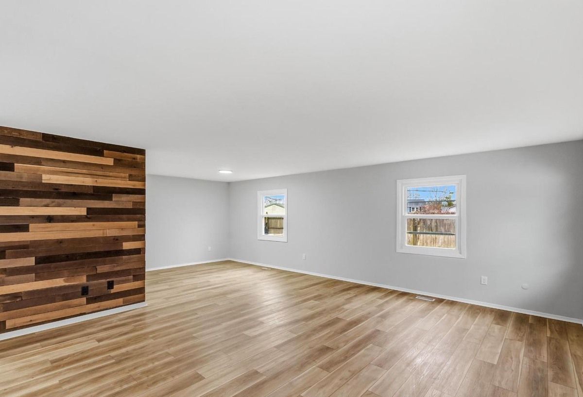 Wide plank LVP with wood accent wall